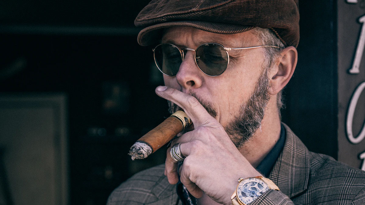 wealthy man smoking cigar